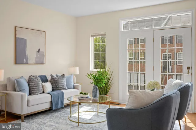 a living room with furniture and windows
