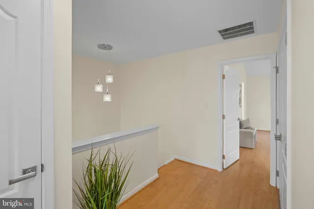 a view of entryway with wooden floor