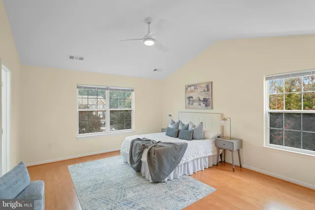 a bedroom with furniture and a window