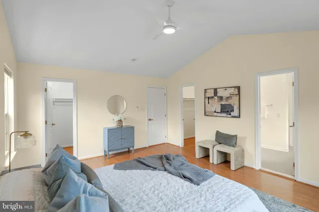 a bedroom with a bed and cabinets