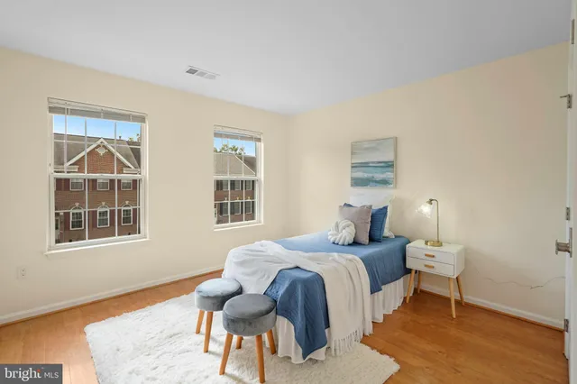 a bedroom with bed and a window