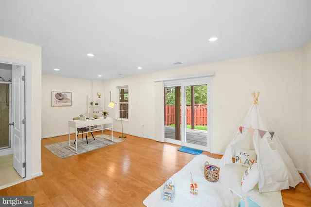 a bed room with a bed and a chair