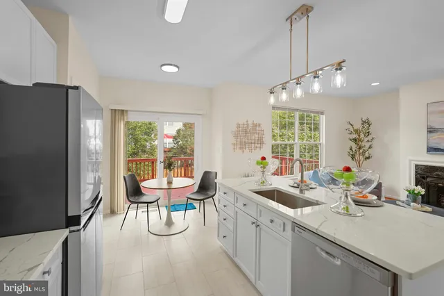 a view of a dining room with furniture large windows and wooden floor