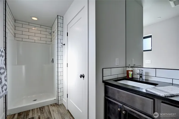 a bathroom with a sink and a mirror
