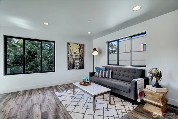 a living room with furniture and a window