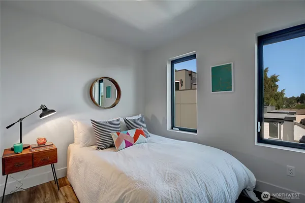 a bedroom with bed and a window