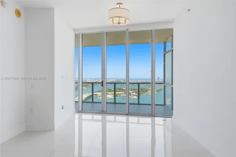 an empty room with glass door
