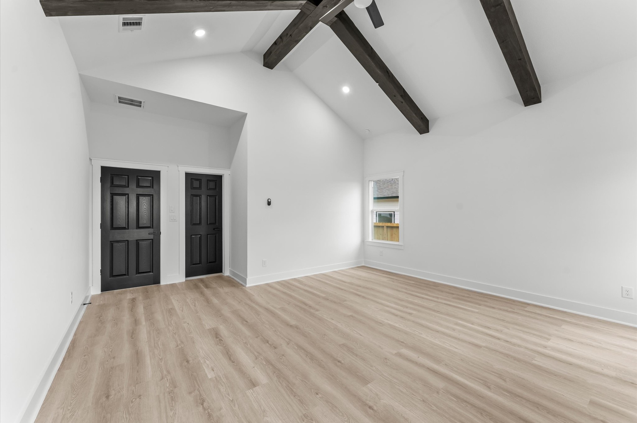 1133 Longleaf Pne Street Huffman, TX 77336 - Photo 17 of 25 Extra-large primary suite with high ceilings and plenty of natural light.