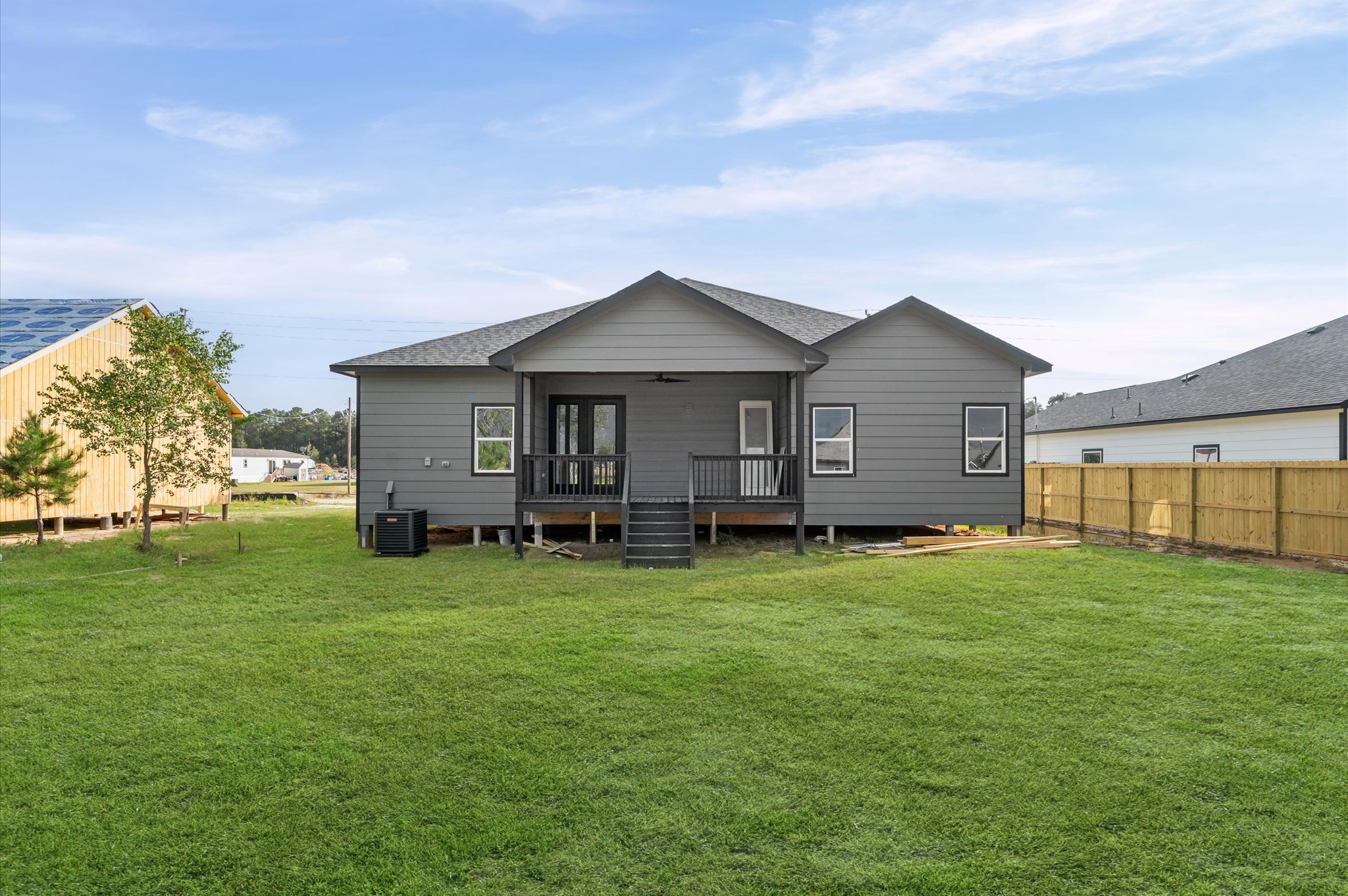 1133 Longleaf Pne Street Huffman, TX 77336 - Photo 25 of 25 Large covered back porch ideal for gatherings or peaceful sunsets. Fence will be added for privacy.