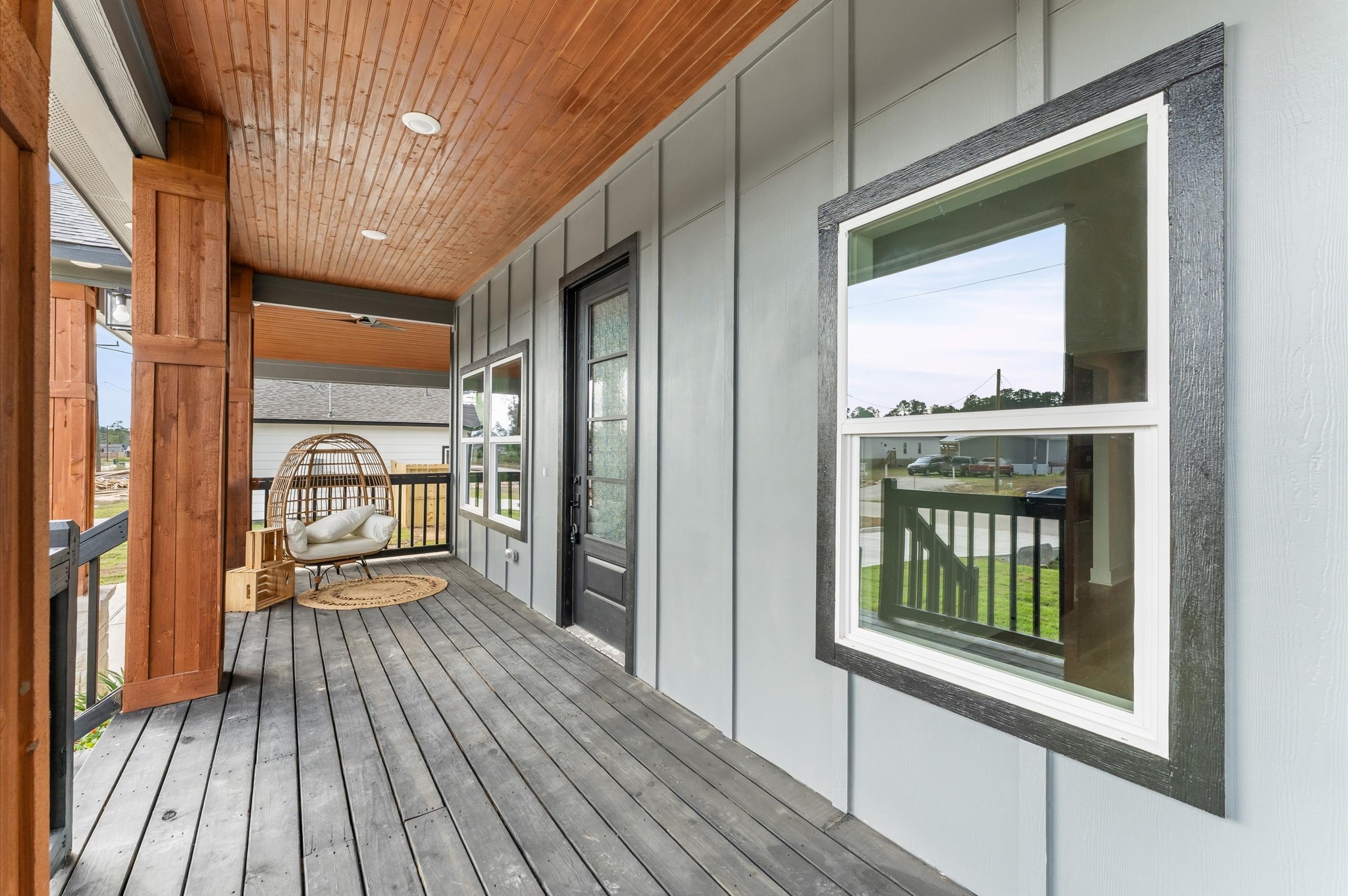1133 Longleaf Pne Street Huffman, TX 77336 - Photo 4 of 25 Large covered front porch with wood accents and LED lighting.