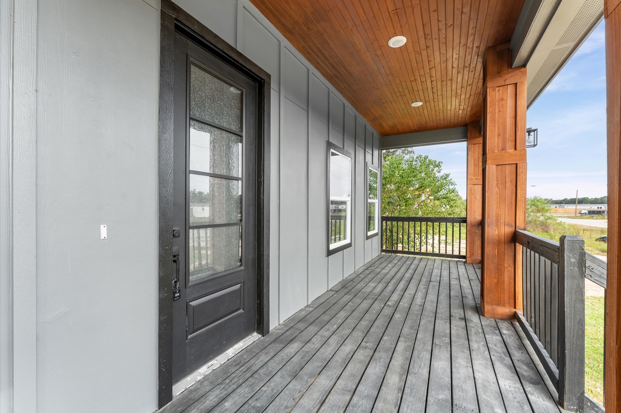 1133 Longleaf Pne Street Huffman, TX 77336 - Photo 6 of 25 Large covered front porch with wood accents and LED lighting.