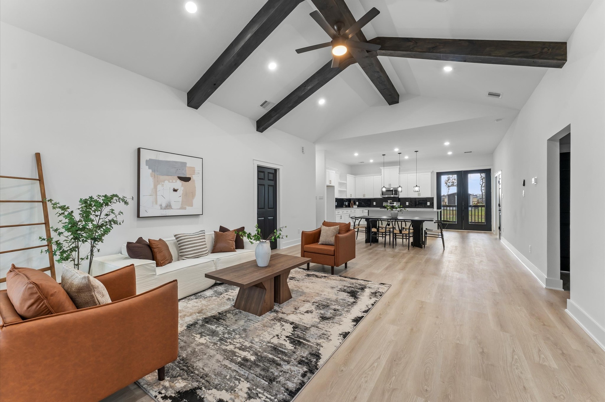 1133 Longleaf Pne Street Huffman, TX 77336 - Photo 7 of 25 Bright and open living area with soaring cathedral ceilings and recessed lighting.