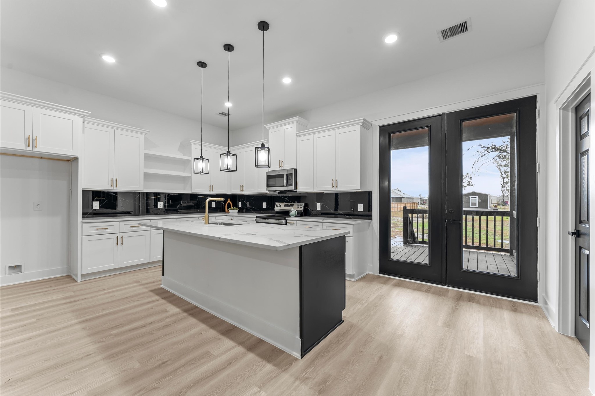 1133 Longleaf Pne Street Huffman, TX 77336 - Photo 10 of 25 Tons of cabinets and storage space with elegant, high-end finishes.