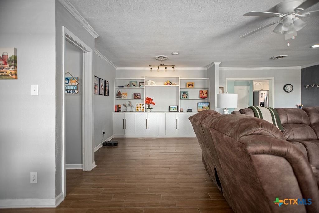 1315 Jackson Street Port Lavaca, TX 77979 - Photo 11 of 32 a living room with furniture and a chandelier