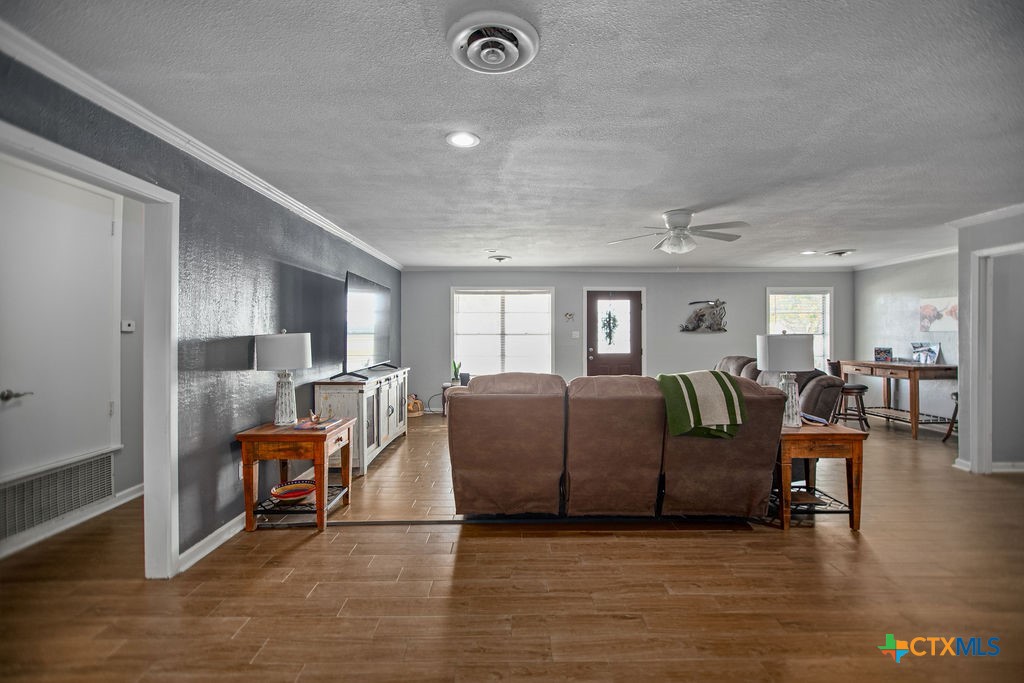 1315 Jackson Street Port Lavaca, TX 77979 - Photo 13 of 32 a living room with furniture and a wooden floor