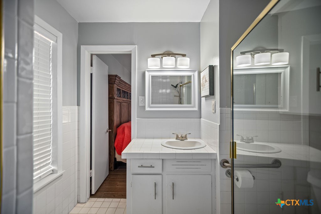 1315 Jackson Street Port Lavaca, TX 77979 - Photo 29 of 32 a bathroom with a sink and a mirror