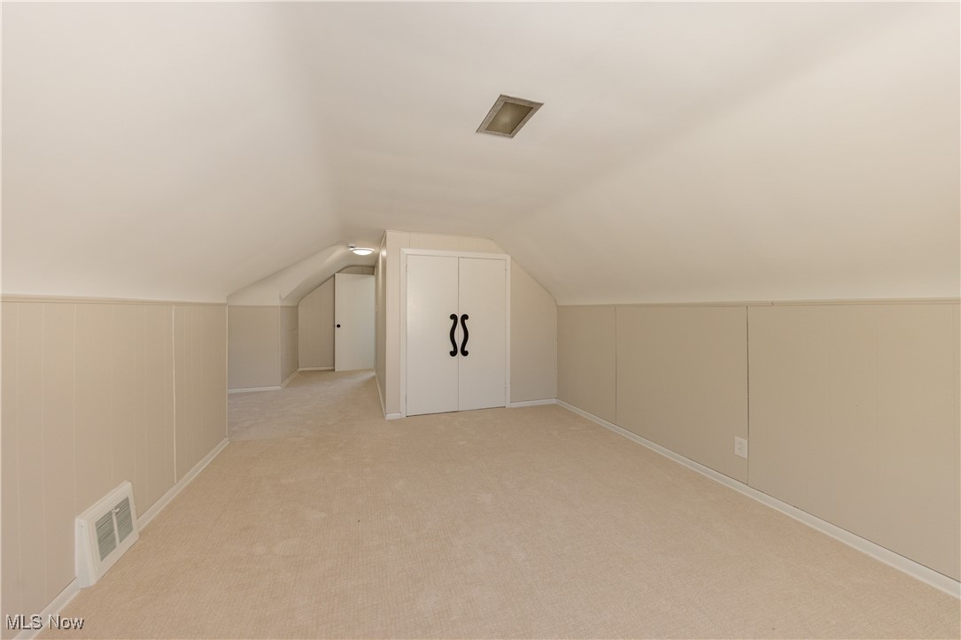 29103 Barjode Road Eastlake, OH 44095 - Photo 18 of 31 Additional living space featuring light colored carpet and vaulted ceiling