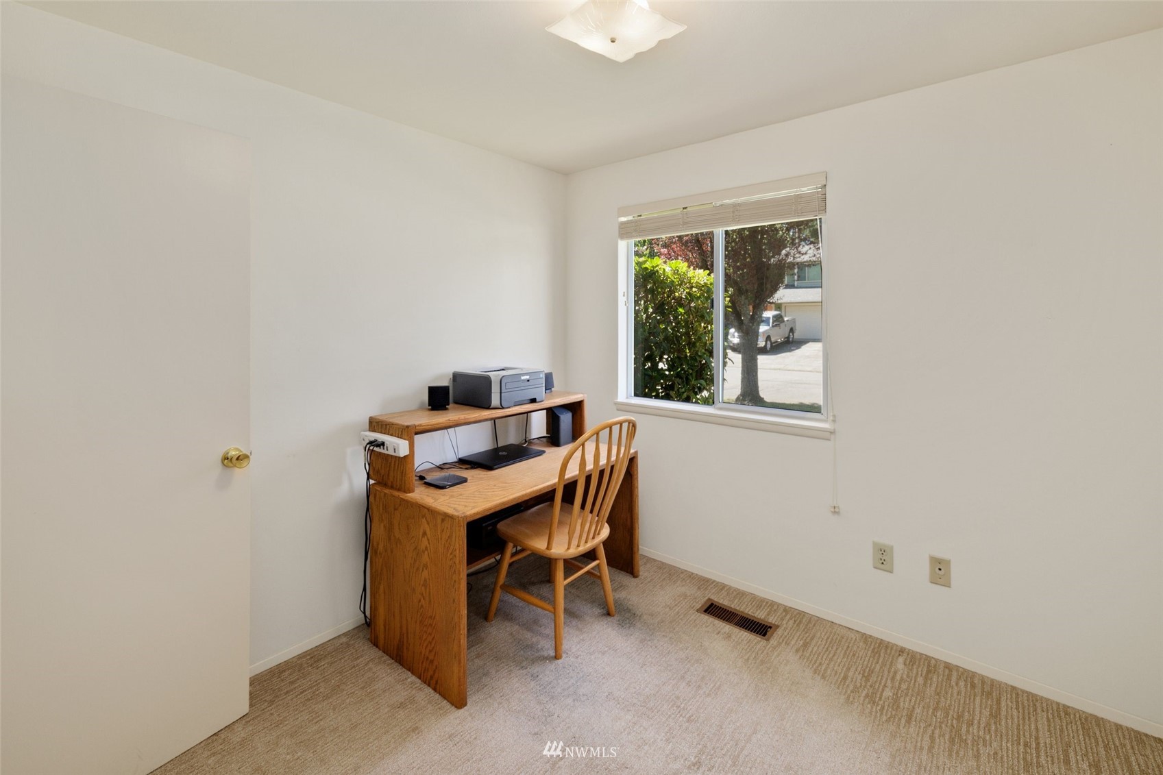 1810 Whitman Avenue Northeast Renton, WA 98059 - Photo 8 of 31 a view of a workspace with furniture and a window