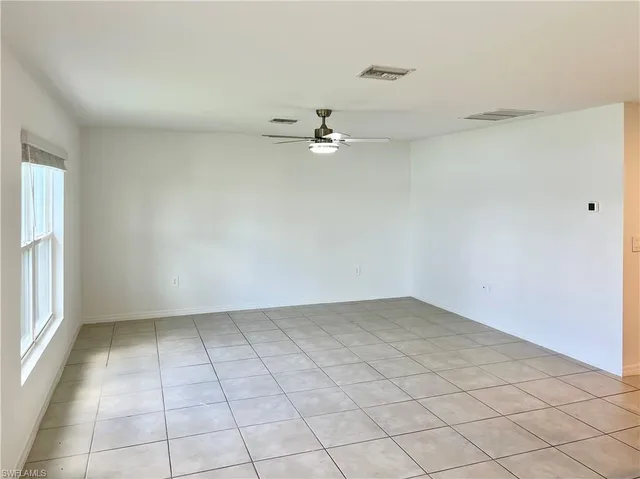 a spacious bathroom with a sink a mirror and a shower