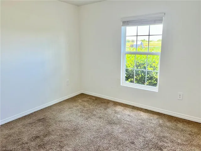 a bathroom with a granite countertop sink a toilet and bathtub
