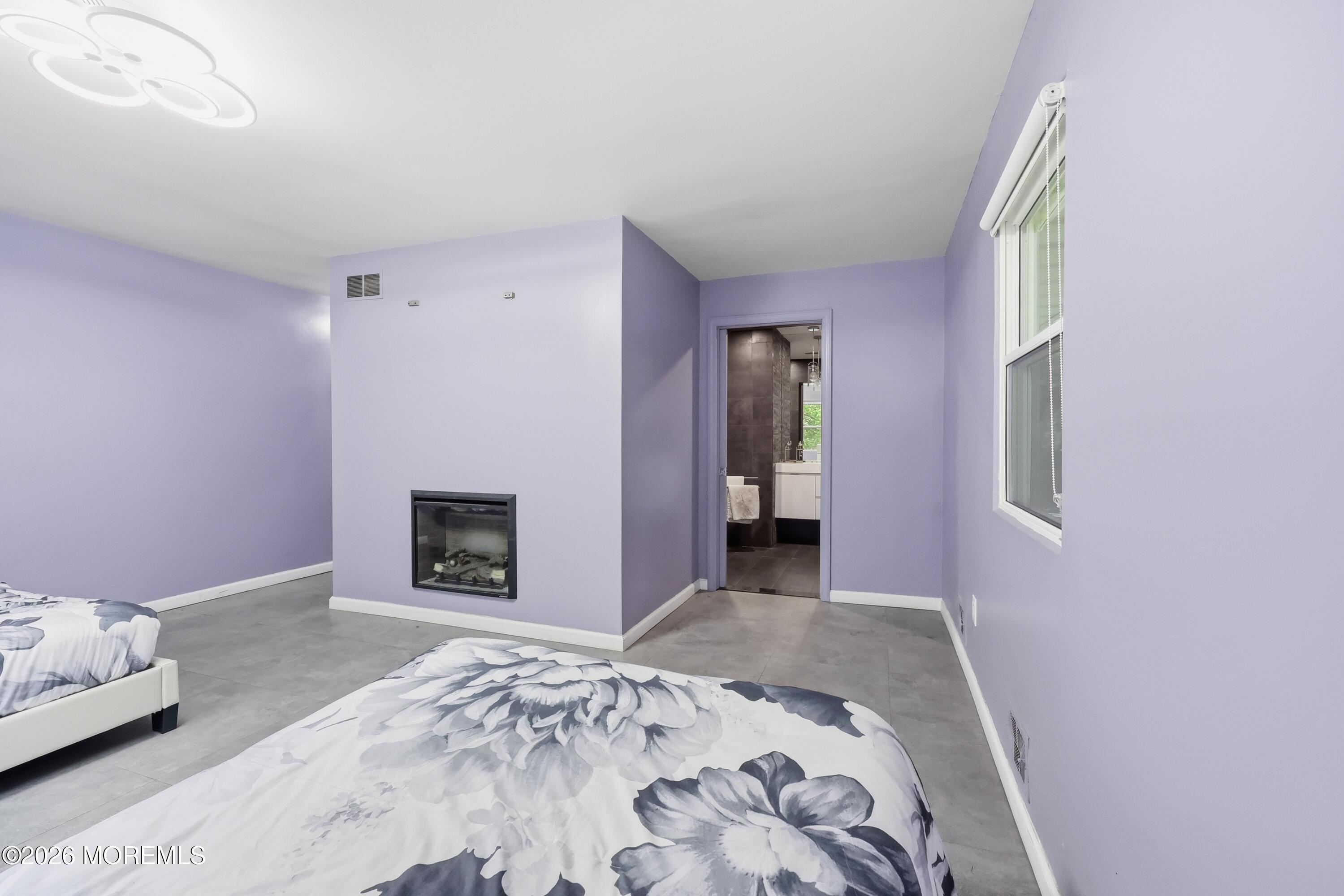 1845 Old Freehold Road Toms River, NJ 08755 - Photo 16 of 27 a view of a livingroom with wooden floor and a fireplace