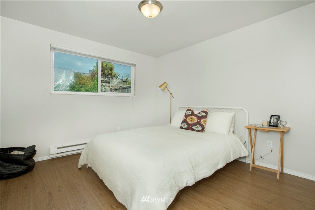 338 Northwest 46th Street Seattle, WA 98107 - Photo 12 of 25 a bedroom with a bed and a dresser