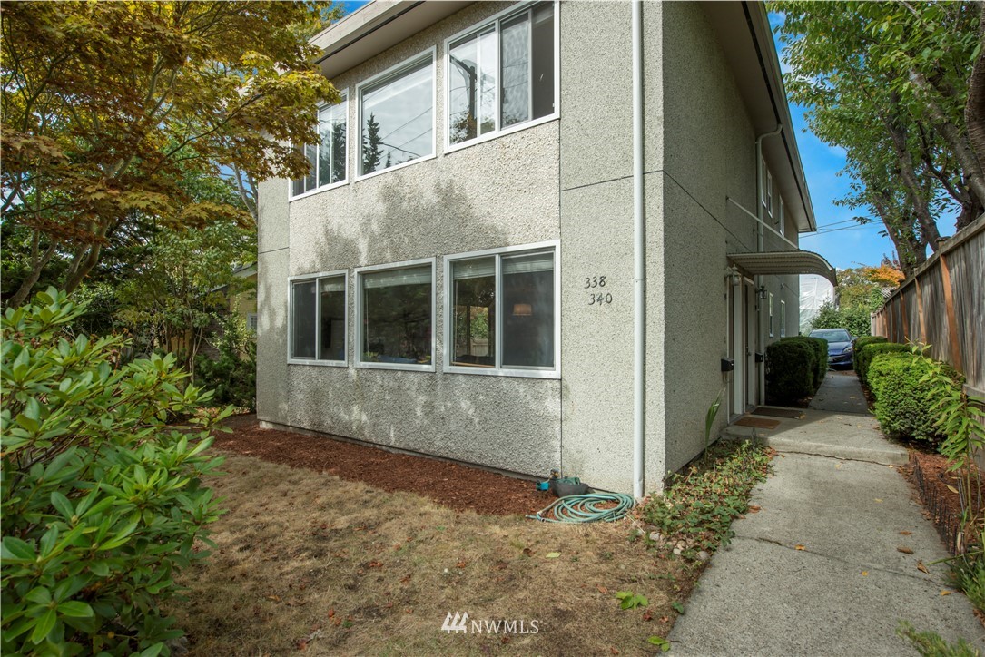 338 Northwest 46th Street Seattle, WA 98107 - Photo 22 of 25 a house with trees in front of it