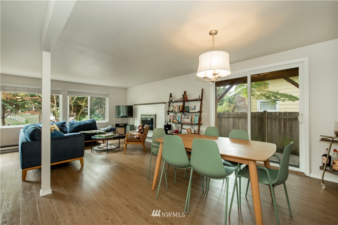 338 Northwest 46th Street Seattle, WA 98107 - Photo 5 of 25 a view of a dining room with furniture window and wooden floor
