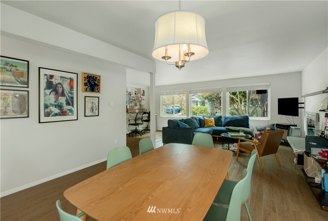 338 Northwest 46th Street Seattle, WA 98107 - Photo 9 of 25 a living room with furniture a dining table and a chandelier