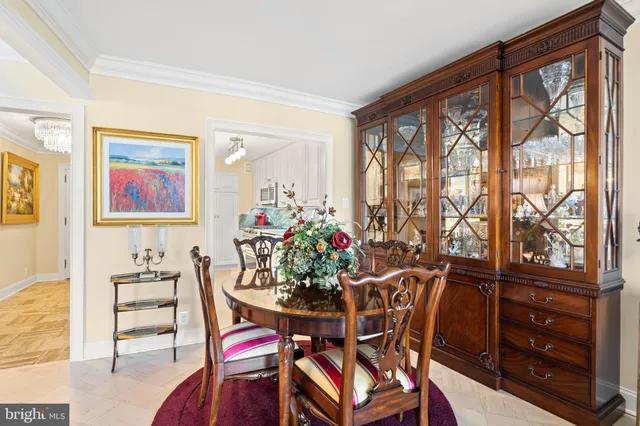 a living room with furniture a rug a fireplace and a flat screen tv