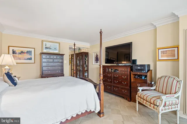 a living room with furniture a fireplace and a large window