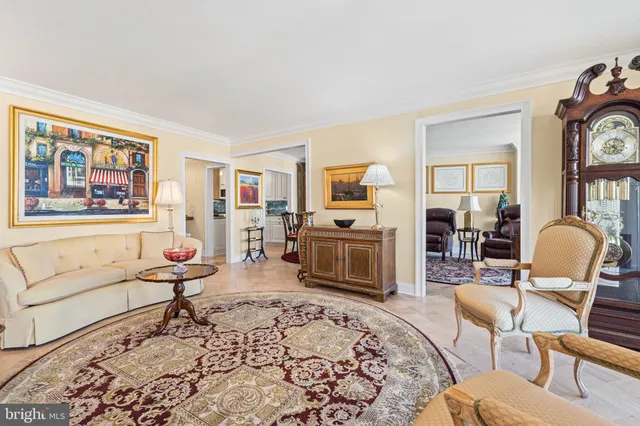 a living room with furniture fireplace and a window