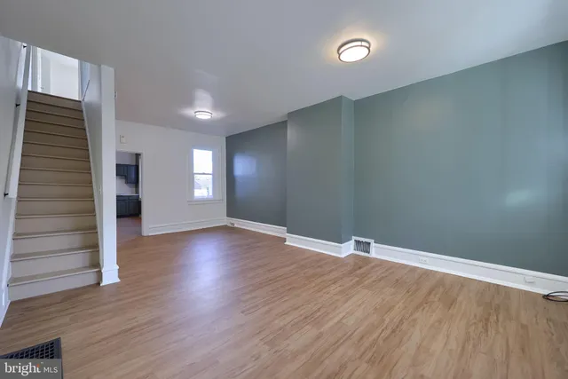 a kitchen with granite countertop a sink stainless steel appliances and cabinets