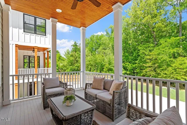 a view of a park with a tree in the background