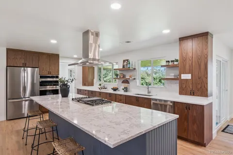 a kitchen with stainless steel appliances granite countertop a counter top and stove