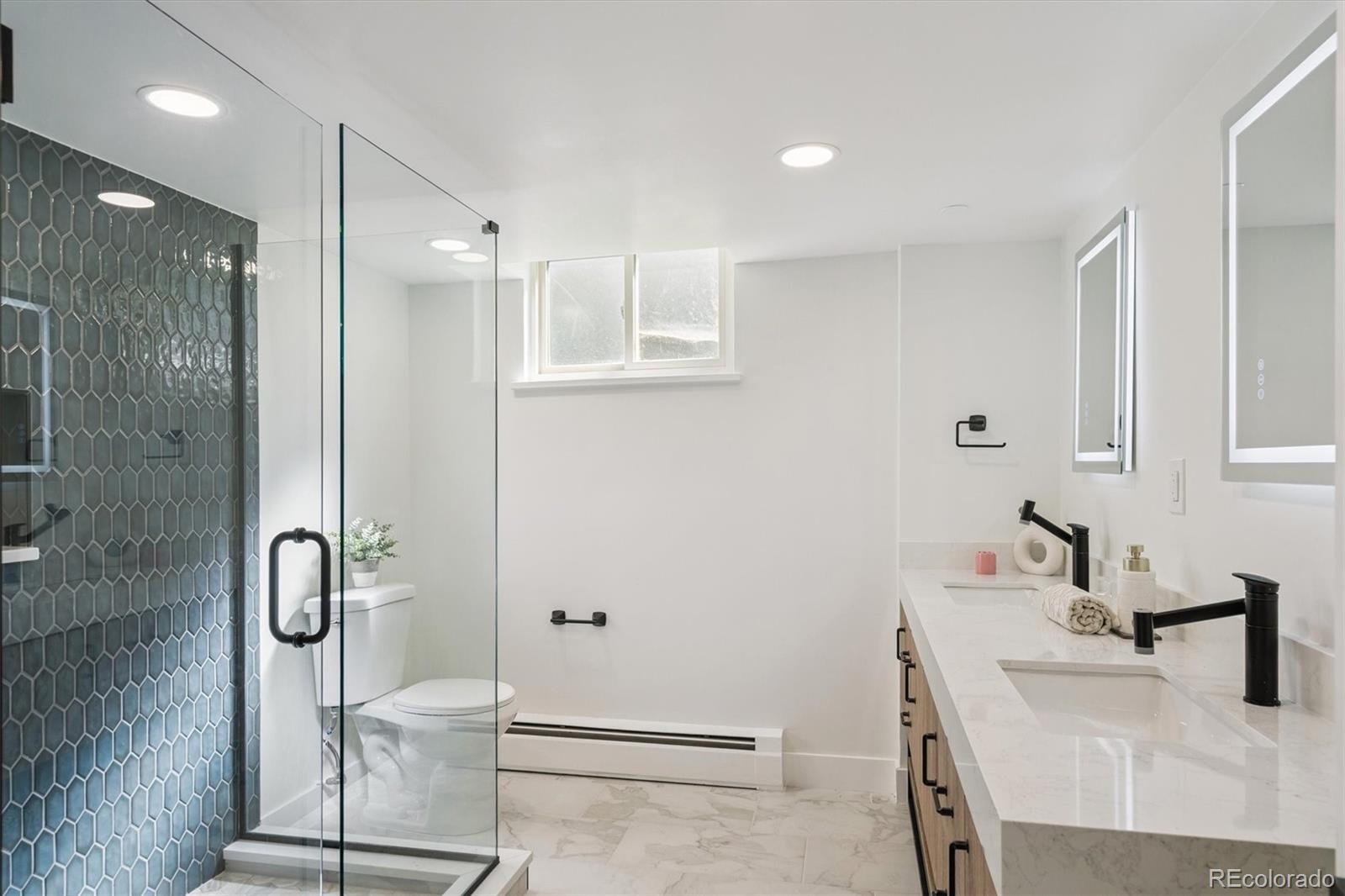 3775 South Forest Way Denver, CO 80237 - Photo 34 of 40 a bathroom with a sink and a mirror