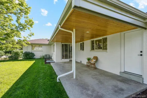 a backyard of a house with seating space