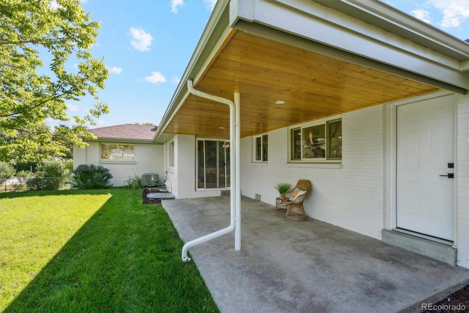 3775 South Forest Way Denver, CO 80237 - Photo 36 of 40 a backyard of a house with seating space