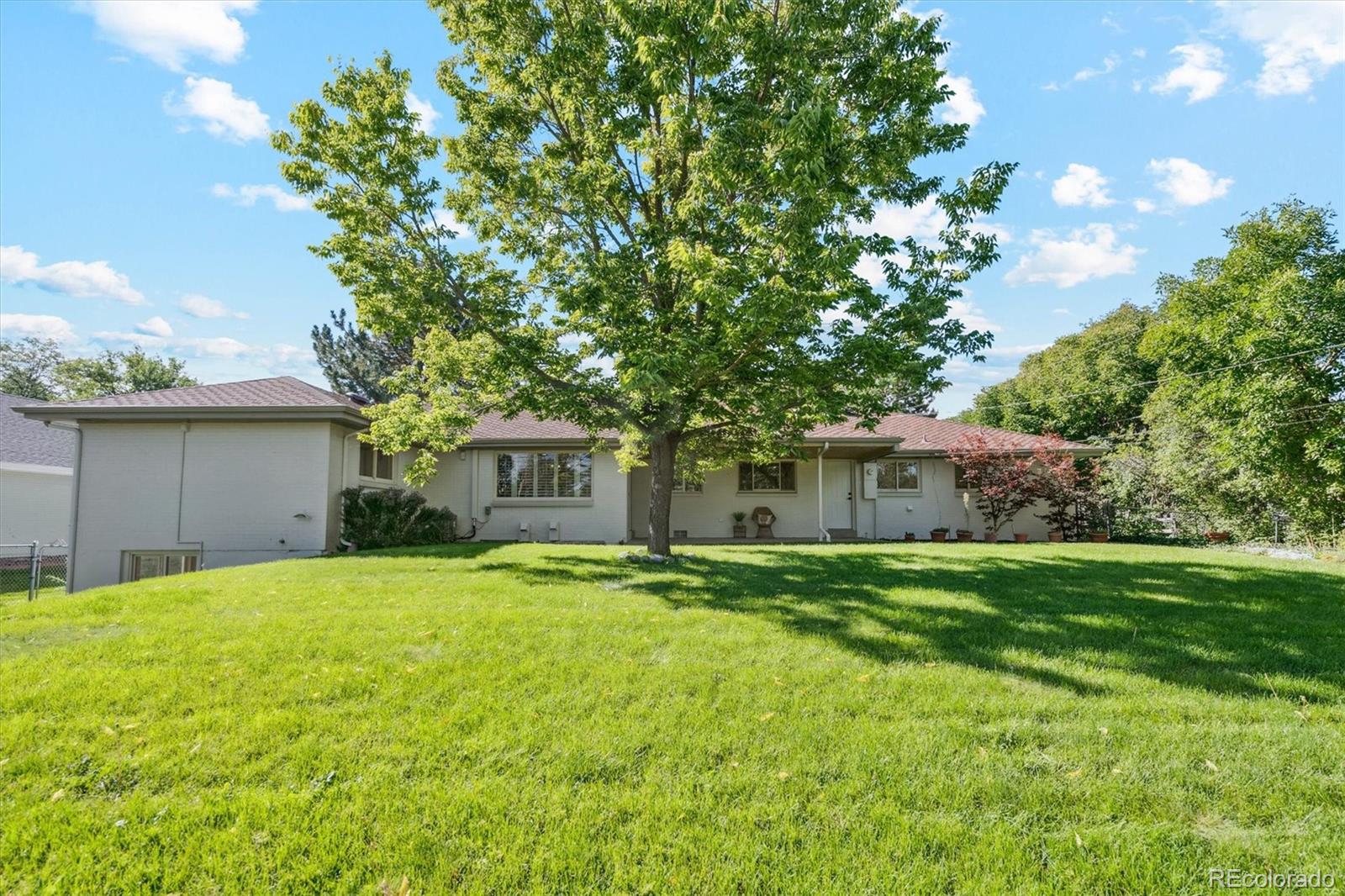 3775 South Forest Way Denver, CO 80237 - Photo 38 of 40 a front view of house with yard and trees