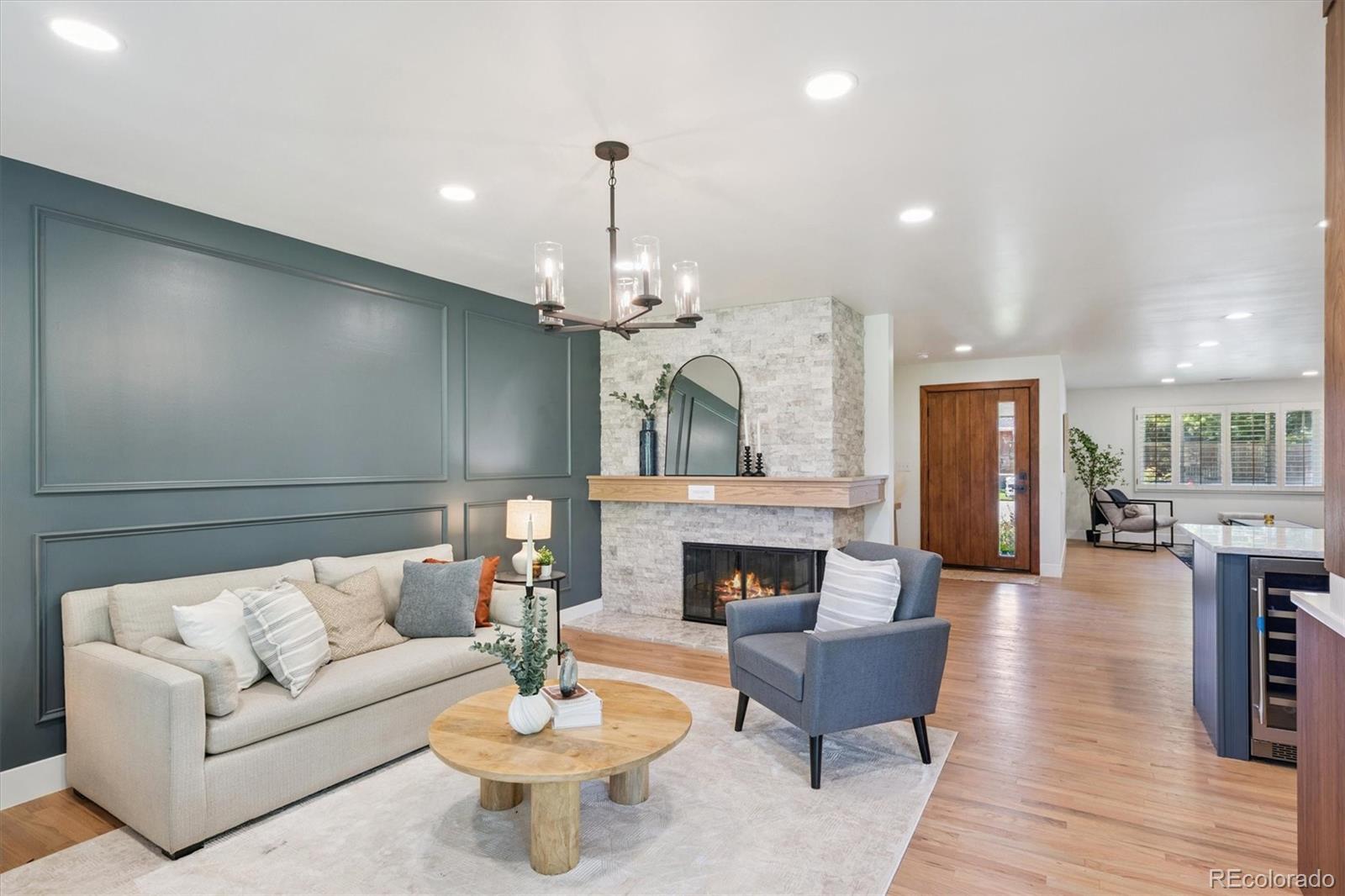 3775 South Forest Way Denver, CO 80237 - Photo 5 of 40 a living room with furniture and a fireplace
