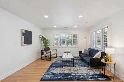 a living room with furniture and a rug