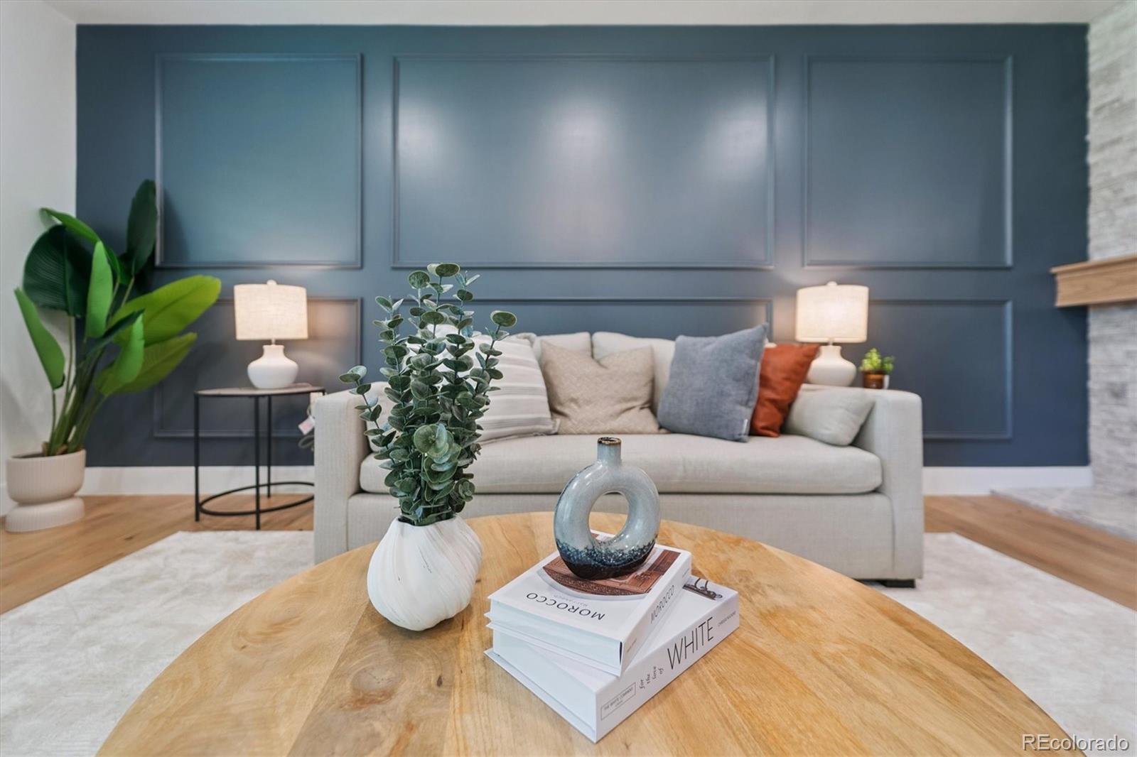 3775 South Forest Way Denver, CO 80237 - Photo 9 of 40 a living room with furniture and potted plant