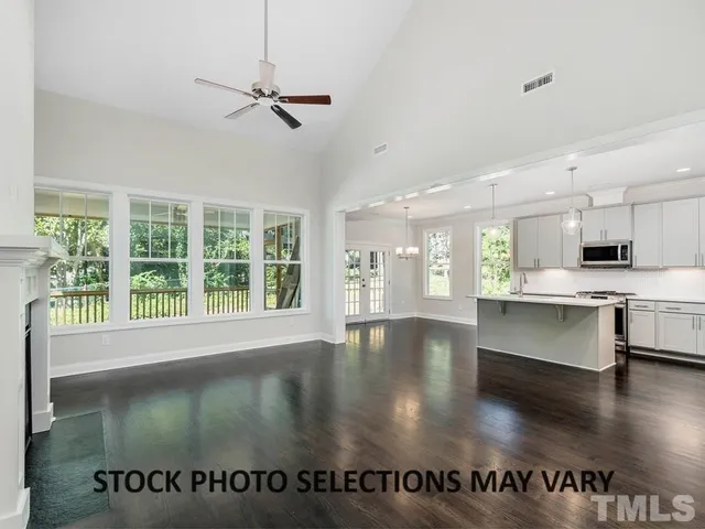 a view of kitchen with refrigerator and window