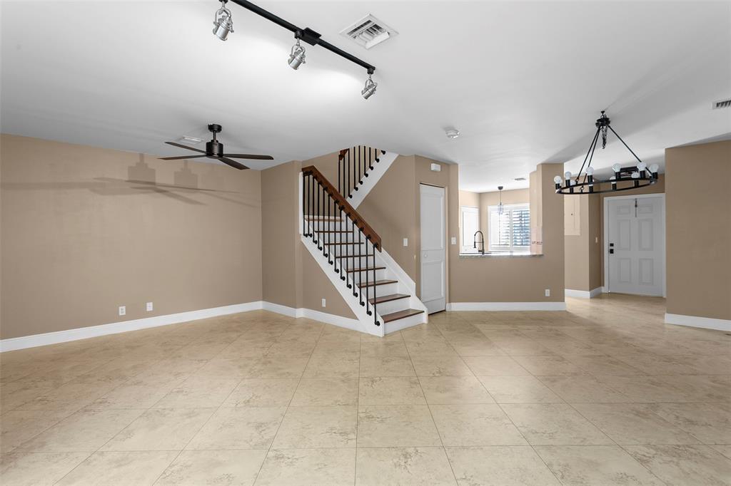 1431 Southwest 48th Terrace, Unit 1431 Deerfield Beach, FL 33442 - Photo 8 of 22 a view of an empty room with a window