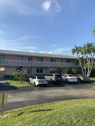a view of a car parked in front of a house