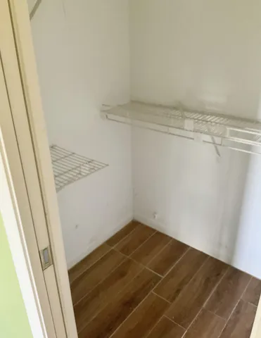 a view of a room with racks on the wall