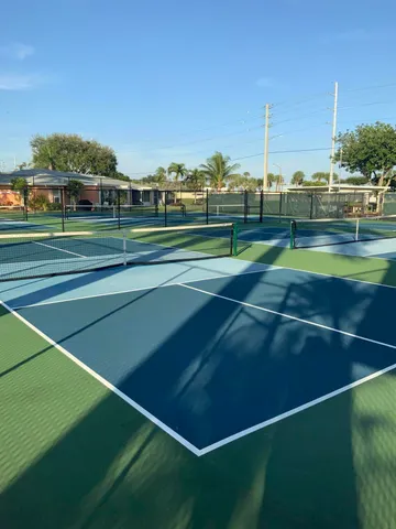 a view of an outdoor space and tennis court