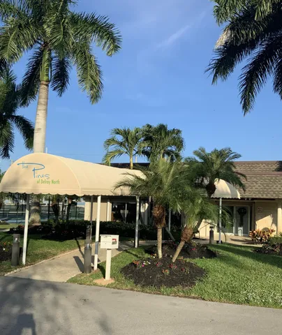 a view of outdoor space with signage and flags
