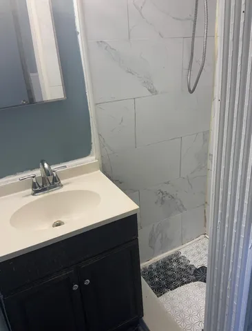 a bathroom with a sink and a mirror