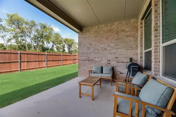 a view of a backyard with a fence